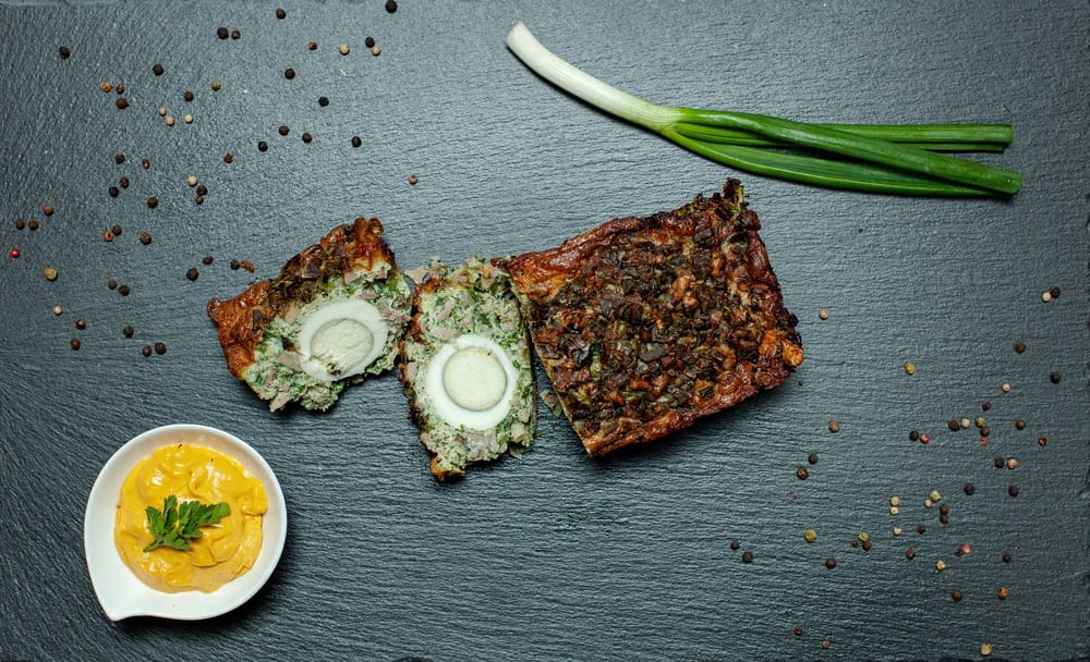 Lamb,Haggis,Terrine,With,Sliced,Eggs,And,Herbs.,Served,With